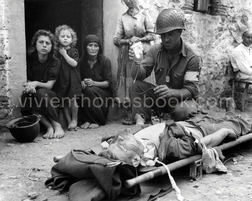 In this World War II image, a soldier in Europe receives a plasma infusion to end his traumatic shock. This treatment was theorized by Alfred Blalock and surgically researched in large part by Vivien Thomas, and it has saved millions of military and civilian lives.